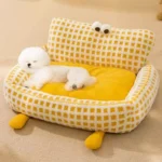 A cozy FluffyEye Haven Plaid Pet Sofa from bichonshop.com, the ultimate comfort spot for Bichons and Malteses, available at Bichon Shop