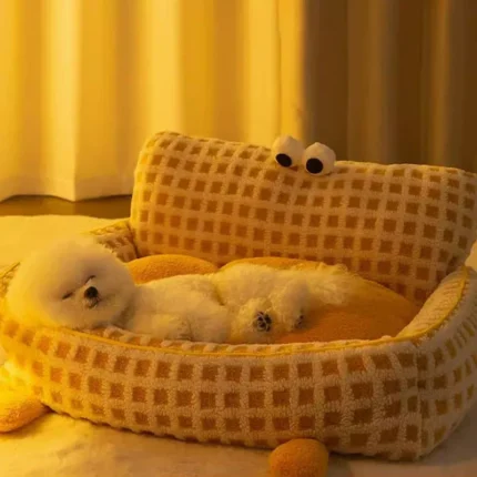 A cozy FluffyEye Haven Plaid Pet Sofa from bichonshop.com, the ultimate comfort spot for Bichons and Malteses, available at Bichon Shop